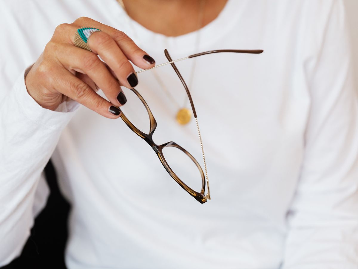 person removing their glasses