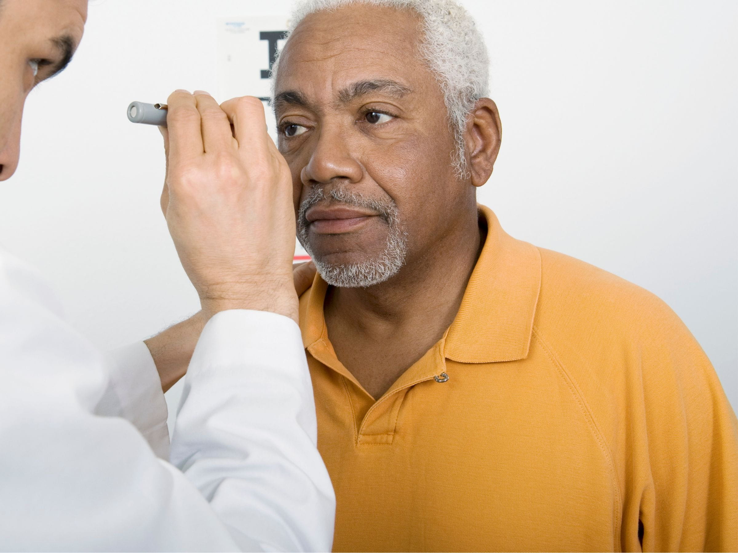 man getting eyes examined